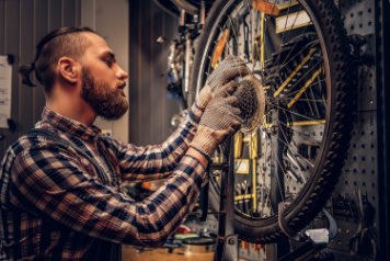 person servicing a bike in Dublin